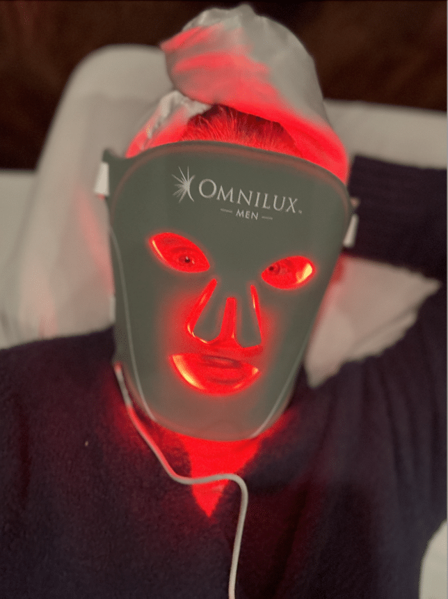 Tania Stephens wearing an Omnilux red light mask for men